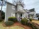Charming two-story home with a well-manicured lawn and tasteful landscaping at 627 New Road, Raleigh, NC 27608