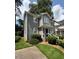 Well-maintained two-story home with gray siding, green lawn, and lush landscaping at 627 New Road, Raleigh, NC 27608