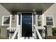 Close-up of a home's front door with black finish, sidelights and decorative hardware at 627 New Road, Raleigh, NC 27608