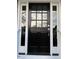 Elegant front door with decorative sidelights and modern hardware at 627 New Road, Raleigh, NC 27608