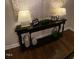 Stylish hallway decor with a sleek console table and decorative lamps at 627 New Road, Raleigh, NC 27608