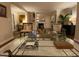View into a formal living room with neutral walls, a fireplace, and a large glass coffee table at 627 New Road, Raleigh, NC 27608