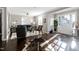 Bright living room with hardwood floors, a cozy sofa, and an inviting entryway at 627 New Road, Raleigh, NC 27608