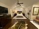 The Primary bedroom offers a ceiling fan, hardwood floors, seating, a TV, and a vaulted ceiling at 627 New Road, Raleigh, NC 27608
