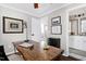 Charming home office featuring a live edge desk and updated fixtures at 627 New Road, Raleigh, NC 27608