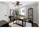 Cozy home office with a rustic wooden desk, a comfortable chair, and ample natural light at 627 New Road, Raleigh, NC 27608