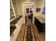 Well-lit butler's pantry with ample cabinet storage and stylish runner rug at 627 New Road, Raleigh, NC 27608