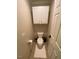 Small powder room with toilet and storage at 627 New Road, Raleigh, NC 27608