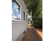 Exterior view of gray home with well maintained backyard with a shed at 627 New Road, Raleigh, NC 27608