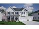 Charming two-story home featuring a three-car garage, covered front porch, and well-maintained landscaping at 75 Guardian St, Youngsville, NC 27596