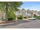 Well-maintained townhome exterior with tidy landscaping and nearby parking at 7856 Spungold St, Raleigh, NC 27617