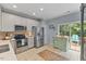 Well-equipped kitchen with stainless steel appliances, bright cabinets, and a cozy breakfast nook at 7856 Spungold St, Raleigh, NC 27617