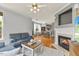 Open-concept living space featuring a fireplace and hardwood floors at 7856 Spungold St, Raleigh, NC 27617