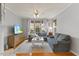 Spacious living room with a plush grey sofa and a mounted television at 7856 Spungold St, Raleigh, NC 27617
