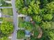 An aerial view of the property showing the landscape design and mature trees at 7916 Foxwood Dr, Raleigh, NC 27615