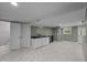 Basement featuring tile floors, a kitchenette, and a doorway to an adjoining room at 7916 Foxwood Dr, Raleigh, NC 27615