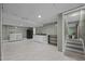 Spacious basement featuring a laundry area, kitchenette, and access to other rooms at 7916 Foxwood Dr, Raleigh, NC 27615