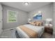 Comfortable bedroom with neutral tones, a plush bed, and natural light from the window at 7916 Foxwood Dr, Raleigh, NC 27615