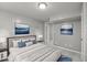 Inviting bedroom featuring large bed with pillows, framed art, and neutral paint at 7916 Foxwood Dr, Raleigh, NC 27615