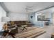 Inviting living room featuring a comfortable sectional, modern decor, and an open view to the kitchen at 7916 Foxwood Dr, Raleigh, NC 27615