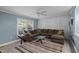Comfortable living room with a spacious sectional, neutral tones, and plenty of natural light at 7916 Foxwood Dr, Raleigh, NC 27615