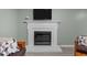 Inviting living room features a cozy fireplace with a mounted television above it at 7916 Foxwood Dr, Raleigh, NC 27615
