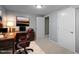 Bright, staged office space with modern desk, leather chair, and ample storage at 7916 Foxwood Dr, Raleigh, NC 27615