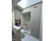 Modern bathroom features a tiled walk-in shower and a skylight at 80 Stoneridge Rd, Durham, NC 27705