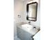 Charming bathroom features a square sink, gray vanity, and a modern black framed mirror at 80 Stoneridge Rd, Durham, NC 27705