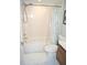 This bathroom features a shower-over-tub combo with white tile surround at 80 Stoneridge Rd, Durham, NC 27705