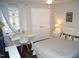 Comfortable bedroom features a desk, closet, and a window with natural light at 80 Stoneridge Rd, Durham, NC 27705
