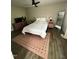 Comfortable bedroom with unique headboard, decorative rug, and plenty of natural light at 80 Stoneridge Rd, Durham, NC 27705
