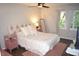 Serene bedroom featuring a comfortable bed, hardwood floors, and soft natural light at 80 Stoneridge Rd, Durham, NC 27705