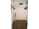 Functional walk-in closet boasts wood floors, shelving, and ample space for storage at 80 Stoneridge Rd, Durham, NC 27705