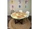 Cozy dining area with a round table, seating for two, and stylish decor at 80 Stoneridge Rd, Durham, NC 27705