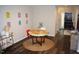 Cozy dining area featuring a round table, modern decor, and hardwood floors at 80 Stoneridge Rd, Durham, NC 27705