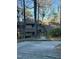 Charming multi-story home nestled amongst trees, providing a serene and private setting at 80 Stoneridge Rd, Durham, NC 27705