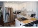 Modern kitchen with stainless steel appliances, sleek countertops, and ample cabinet space at 80 Stoneridge Rd, Durham, NC 27705