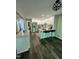 Stylish kitchen with an island with bar stool seating, stainless steel appliances and white cabinets at 80 Stoneridge Rd, Durham, NC 27705