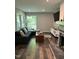 Comfortable living room featuring a fireplace, large windows, and modern furnishings at 80 Stoneridge Rd, Durham, NC 27705