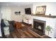 Bright living room with a modern fireplace, sleek hardwood floors, and stylish decor at 80 Stoneridge Rd, Durham, NC 27705