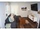 Spacious living room featuring hardwood floors, comfortable seating, and plenty of natural light at 80 Stoneridge Rd, Durham, NC 27705