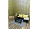 Outdoor patio features modern furniture, a stylish rug, and decorative accents at 80 Stoneridge Rd, Durham, NC 27705