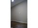 Small room with gray walls and wood-look floors offers a clean, neutral space at 80 Stoneridge Rd, Durham, NC 27705