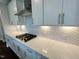 Beautiful kitchen featuring white cabinets, quartz countertops, stainless steel appliances and a gas cooktop at 820 Emerald Bay Cir # 762, Raleigh, NC 27610