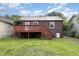 A house with a backyard and wooden deck at 919 Chester St, Durham, NC 27701