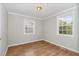 This bedroom has hardwood floors and two windows at 919 Chester St, Durham, NC 27701