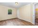 Bedroom with hardwood floors and natural light from window at 919 Chester St, Durham, NC 27701
