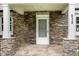 Close-up of the stone-clad front porch and entrance to the charming home at 919 Chester St, Durham, NC 27701