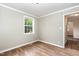 Hallway featuring hardwood floor and access to an adjoining room at 919 Chester St, Durham, NC 27701